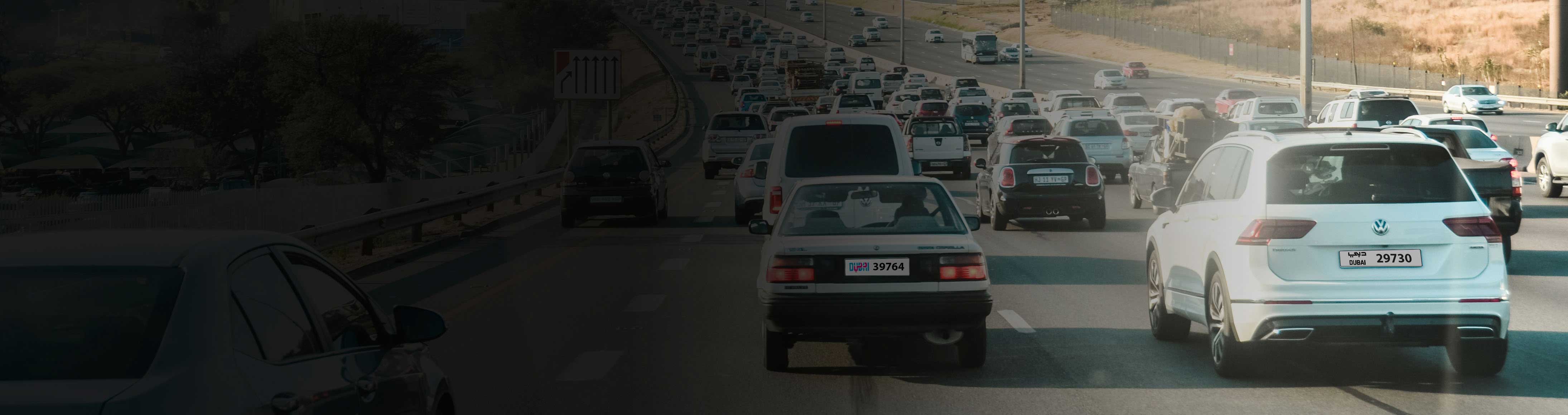 banner image of multiple cars driving on a highway, showcasing the anpr highway system for automated number plate recognition and traffic management.