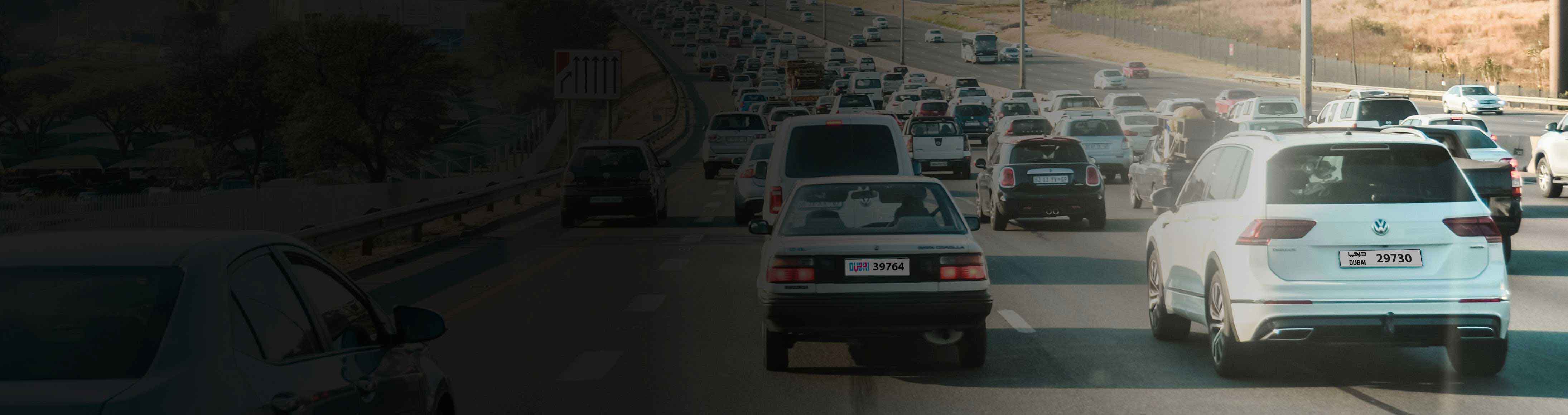 banner image of multiple cars driving on a highway, showcasing the anpr highway system for automated number plate recognition and traffic management.