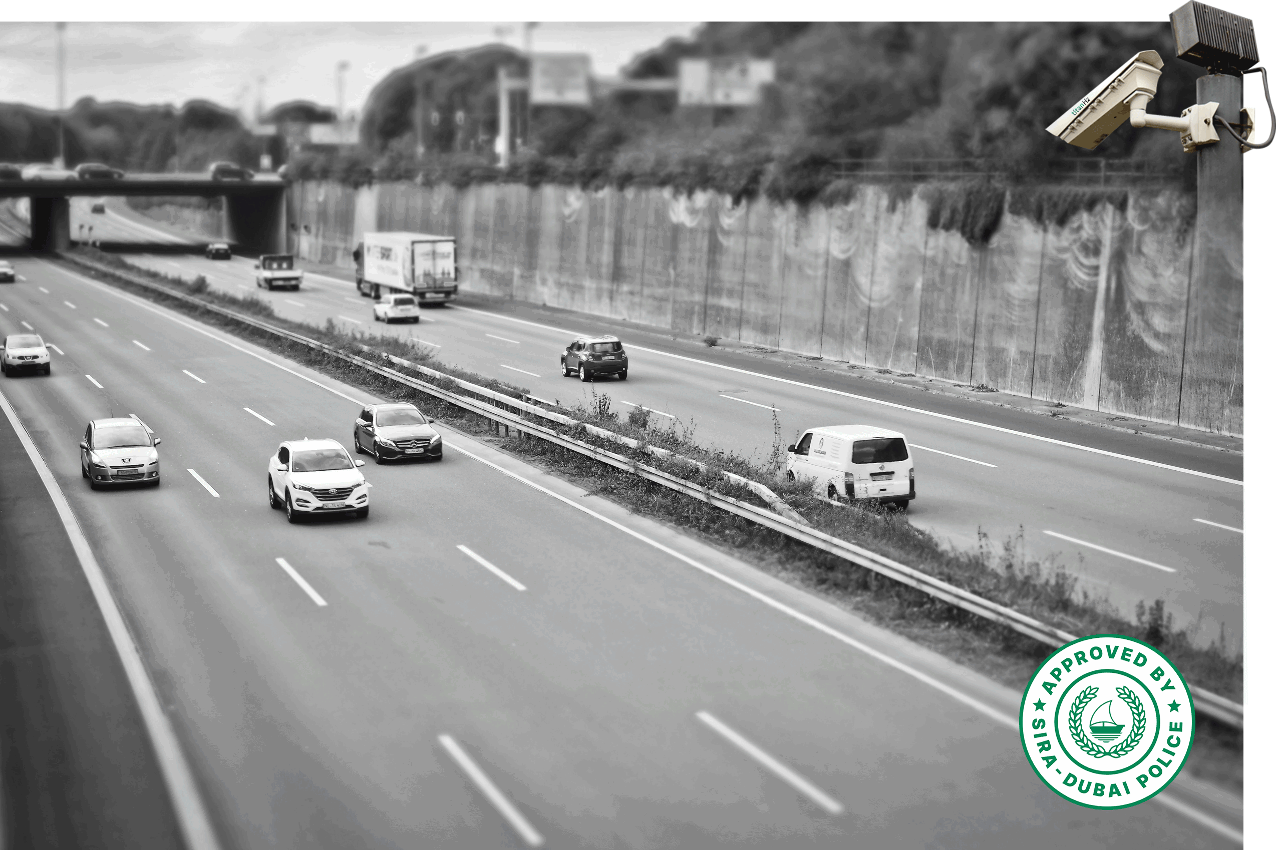cars driving on a highway with a titanhz anpr camera on a pole, monitoring traffic flow and vehicle number plate recognition.