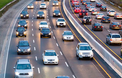 highway with multiple cars passing through, monitored by anpr system for vehicle identification and tracking