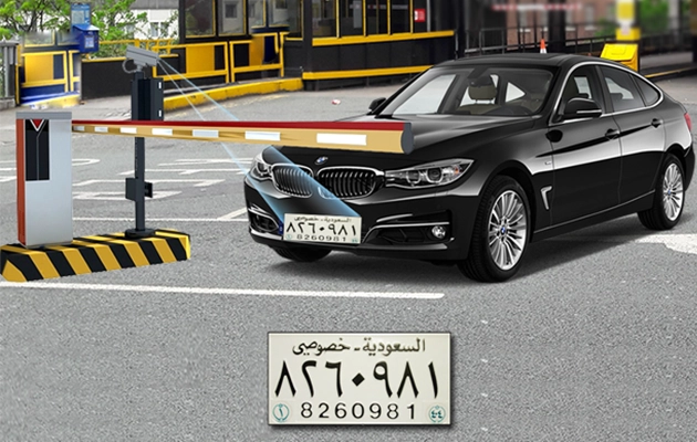 a car entering a parking zone with a boom barrier and anpr camera scanning the license plate, displayed larger below the image.