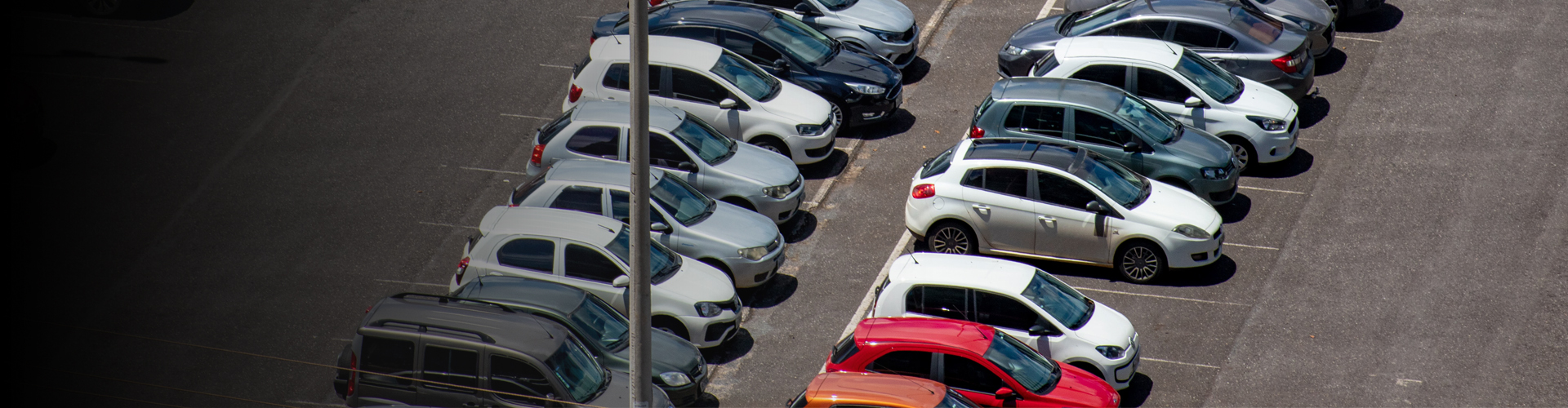 a banner image of a parking zone with multiple cars parked, showcasing anpr parking systems for efficient vehicle management.