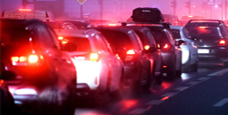 multiple cars in traffic area at night, monitored by anpr system for intelligent transport and vehicle tracking