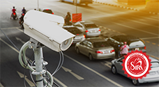 multiple cars and bikes passing in city traffic, captured by anpr camera for central monitoring and vehicle tracking