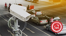 multiple cars and bikes passing in city traffic, captured by anpr camera for central monitoring and vehicle tracking
