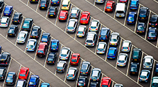 top view of multiple cars parked outside, monitored by anpr system for efficient parking management and space monitoring